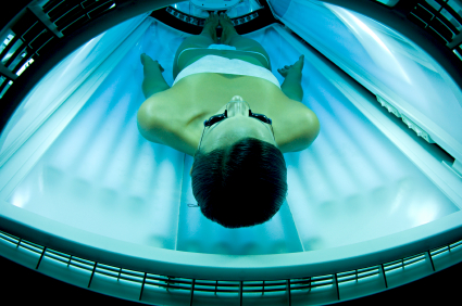 Woman in tanning bed