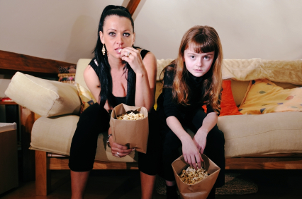 Television Watching Mom and Daughter